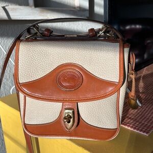 Vintage Dooney and Bourke, all weather pebbled leather Crossbody carrier…